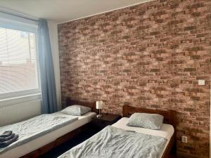 Posteľ alebo postele v izbe v ubytovaní Žižkov Cosy Studio Apartments