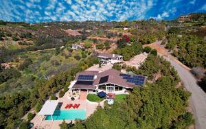 an aerial view of a large house with a pool at Hilltop Villa, Pool, Hot tub, Views, Avocado Grove in Fallbrook