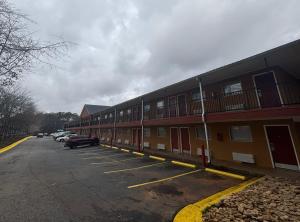 an empty parking lot in front of a building at Live In Lodge Stone Mountain in Stone Mountain
