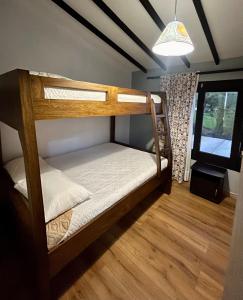 a room with two bunk beds and a window at LP Finca la Pergola, Naturaleza con Lujo y una increíble vista a todo Medellín in Medellín +40 photos