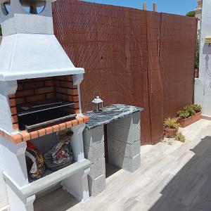a brick oven sitting on top of a patio at Casa Juanlu in Málaga