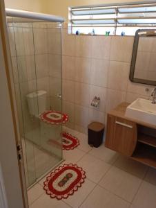 a bathroom with a shower and a sink at Casa em Aparecida SP in Aparecida +41 photos