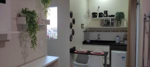 a kitchen with a sink and a counter top at Hospedagem Quarto Chic centro Cunha in Cunha +63 photos
