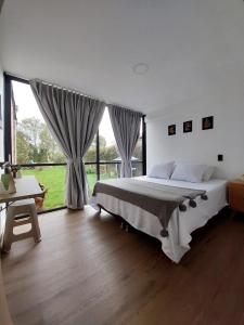 Postel nebo postele na pokoji v ubytování Nordika House - ideal para fotografía y descanso