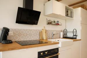 Kuchyň nebo kuchyňský kout v ubytování Duplex vue sur les montagnes - Orbey