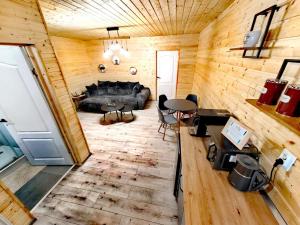 an overhead view of a living room in a log cabin at Cabane A-frame CeziAde Tihuta in Piatra Fantanele