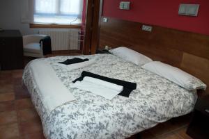 Posteľ alebo postele v izbe v ubytovaní Hotel Cuéntame