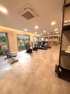 a gym with a row of treadms and elliptical machines at Flat Premiun Vila Madalena in Sao Paulo +11 photos