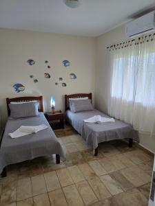 Una cama o camas en una habitación de Casa Azul de Genipabu - Natal 27 fotos más