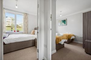 Ένα ή περισσότερα κρεβάτια σε δωμάτιο στο Hampton - 5 beds, 2 bathroom, Garden, Free Parking