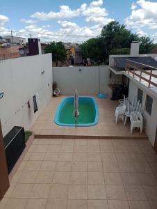 a swimming pool on the roof of a house at Host Family S in São Gabriel