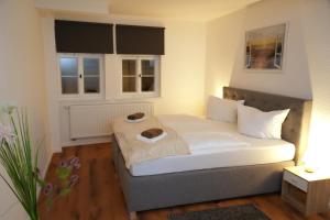 Ένα ή περισσότερα κρεβάτια σε δωμάτιο στο Apartment DOM V - Erfurt Domplatz