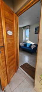 an open door to a living room with a couch at Moon Moods Curaçao in Grote Berg