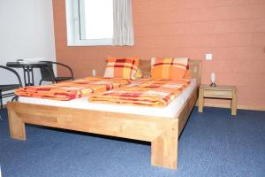 Postel nebo postele na pokoji v ubytování Towerhotel