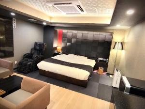 Postel nebo postele na pokoji v ubytování Hotel Aria(Adult Only)