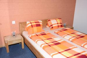 Postel nebo postele na pokoji v ubytování Towerhotel