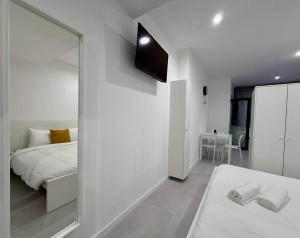 Postel nebo postele na pokoji v ubytování SÉ - BRAGA Lounge Suites COLLECTION BY PERPETUAL RELAX