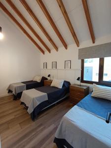 Postel nebo postele na pokoji v ubytování Refugio en el Bosque