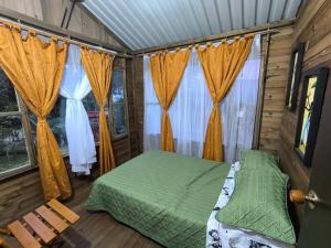 A bed or beds in a room at Cabañas Los Profes