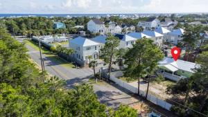 an aerial view of a residential neighbourhood with a red marker at R3 Orange at Inlet Beach with Pool, EV Connector and RV Parking in Inlet Beach