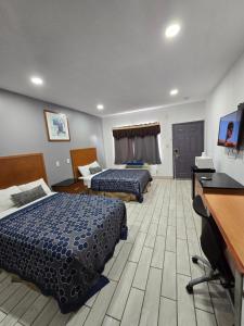 Ένα ή περισσότερα κρεβάτια σε δωμάτιο στο Executive Inn Laguna Vista +40 φωτογραφίες