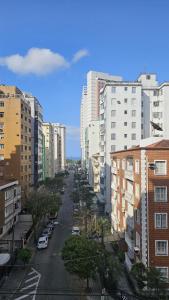 a view of a city street with tall buildings at Studio luxo em Santos vista ao mar in Santos