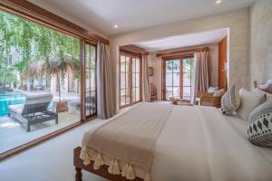 Ένα ή περισσότερα κρεβάτια σε δωμάτιο στο White Goose Boutique Hotel +82 φωτογραφίες