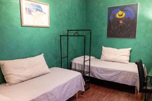 Postel nebo postele na pokoji v ubytování CASA IMMAGINALISTi