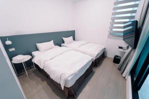 Sunny Sky Homestay客房内的一张或多张床位