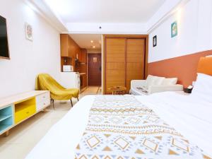 Voodi või voodid majutusasutuse Guangzhou Uhome Service Apartment toas
