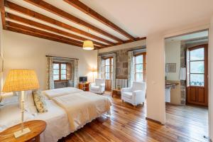 a bedroom with a bed and a living room at Casa Doña Blanca, Ourense in San Clodio +53 photos