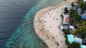 an overhead view of a beach with a group of people at Bgs Place Moalboal in Moalboal +11 photos