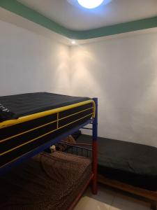 a room with two bunk beds and a ceiling at Casa de tres Unique Welcoming Familiar in San Miguel
