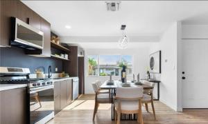 a kitchen and dining room with a table and chairs at Cozy beautiful house in Glendora