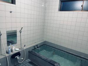 Koupelna v ubytování 民宿上田屋