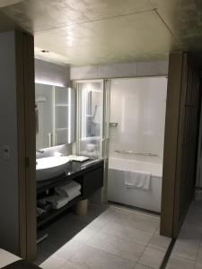 a bathroom with a sink and a tub and a toilet at ANA Crowne Plaza Hotel Kyoto by IHG in Kyoto