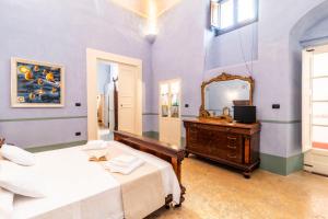 Letto o letti in una camera di Palazzo Insula