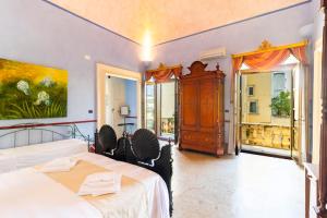 Letto o letti in una camera di Palazzo Insula