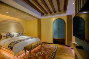 Postelja oz. postelje v sobi nastanitve Lijiang Hearing Flower Hall Garden Inn Butterfly Language Shop
