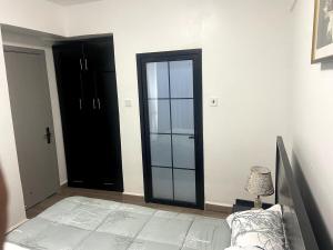 Postel nebo postele na pokoji v ubytování City Lofts Kampala + 7 fotografií