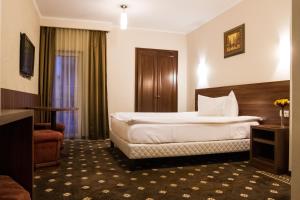 Ein Bett oder Betten in einem Zimmer der Unterkunft Hotel Hermes
