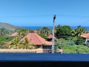 a view of a house with palm trees at Altos de Guarame in Flandes