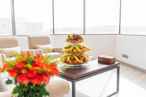 a display of fruit on a table in a room at Aram Hotel - AlMeshael Exit 18 in Riyadh