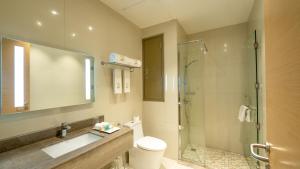 a bathroom with a shower and a sink and a toilet at Aram Hotel - AlMeshael Exit 18 in Riyadh