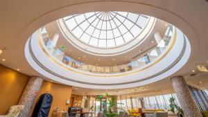 an image of a building with a domed ceiling at Aram Hotel - AlMeshael Exit 18 in Riyadh