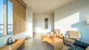 a living room with a couch and a table at Aram Hotel - AlMeshael Exit 18 in Riyadh
