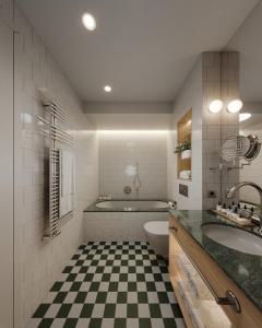 a bathroom with a black and white checkered floor at Hôtel Maison Borrèze in Souillac