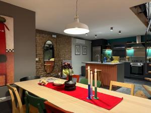 a kitchen and dining room with a table with candles at Stunning Private House in Balat in Istanbul
