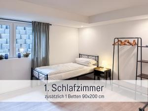En eller flere senge i et værelse på Casa Katalina Filderstadt,!!!Aktuell nur 1 Schlafzimmer!!!, top für Familien und Geschäftsreisen, super ausgestattet, mit PKW Stellplatz