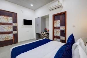 Postel nebo postele na pokoji v ubytování Hotel Warm Welcome Inn - Noida Sector 26